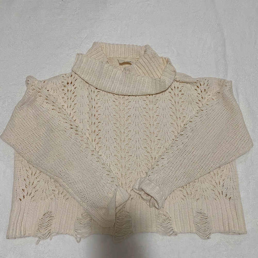 White sweater with cutouts